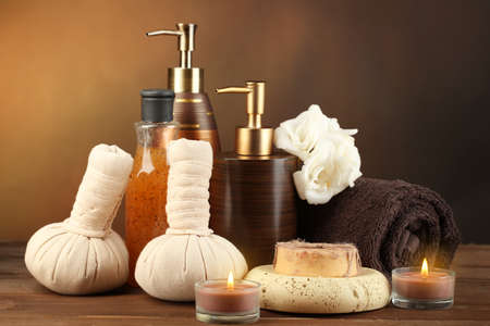 Composition of spa treatment on wooden table, on dark color backgroundの写真素材