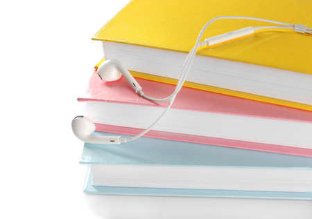 Earphones and books on table, closeupの写真素材