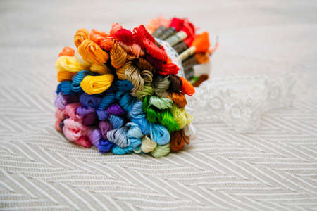 A bright bouquet of threads of mulina. The bouquet is bandaged with tapeの写真素材