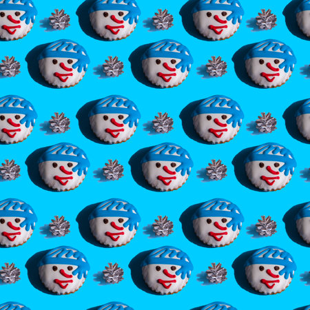 Seamless background with gingerbread in the form of snowman, fir cones on a vivid blue background....