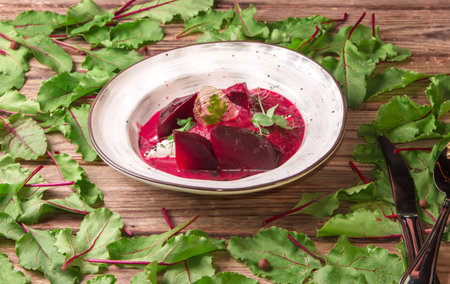 Thick beet soup with mozzarella and parsley in gelatin, sprinkled with sesame seeds, garnished with...