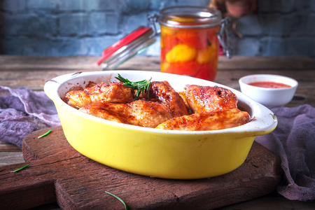 Chicken Wings, Oven Baked and Grilled. Homemade Tasty Food. Wood Table Background, Rustic Still Life Style.の写真素材