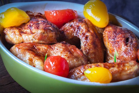 Chicken Wings, Oven Baked and Grilled. Homemade Tasty Food. Wood Table Background, Rustic Still Life Style. Close up.の写真素材