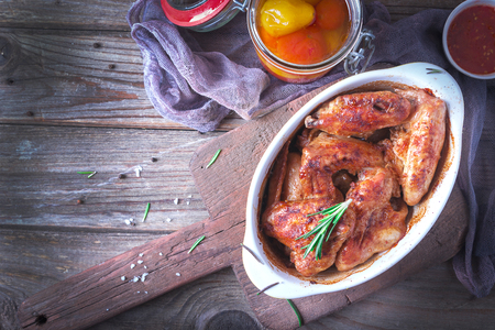 Chicken Wings, Oven Baked and Grilled. Homemade Tasty Food. Wood Table Background, Rustic Still Life Style.の写真素材