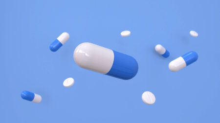Medicine capsules on a blue background. 3d renderingの写真素材