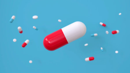 Falling antibiotic capsules isolated on light green background. Health care and medical concept. 3D renderingの写真素材