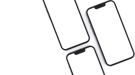 White realistic smartphones mockup. 3d mobile phones with blank white screen. Modern cell phones template on white background. 3d renderの写真素材