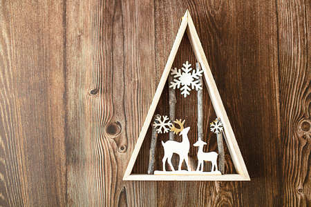 Concept - Christmas wood background with lights and tree with copy spaceの写真素材