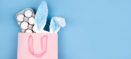 Wide banner on a blue background. The concept of online shopping for Easter