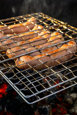 cooking juicy sausages, barbecue on the natureの写真素材