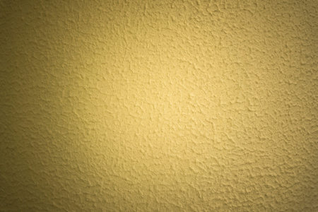 abstract yellow concrete wall background, sunbeam in shadow