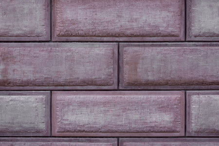 clay tiles textured background. wall with natural sandstone tiles. brickwork in even rows