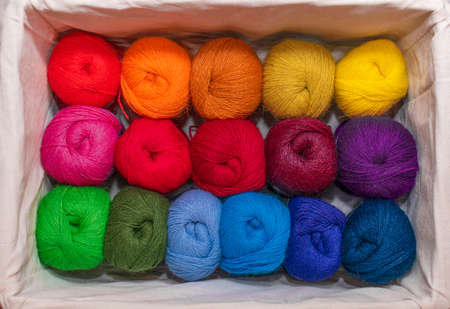 Skeins of colorful threads in a warm colors for embroidery and sewing in the boxの写真素材