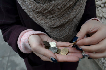old woman counts the little change.