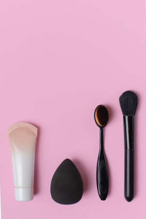 Cosmetics and accessories on a pink background. flat layの写真素材