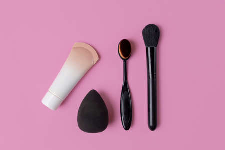 Cosmetics and accessories on a pink background. flat layの写真素材