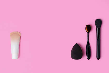 Cosmetics and accessories on a pink background. flat layの写真素材
