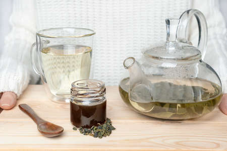 tea ceremony, of the glass teapot flow green tea in cup.の写真素材