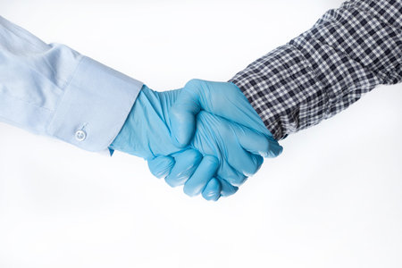 Handshake in gloves. epidemic 2020. coronavirus. the fight versus the virus. pandemic. covid-19の写真素材