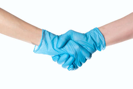 Handshake in gloves. epidemic 2020. coronavirus. the fight versus the virus. pandemic. covid-19の写真素材