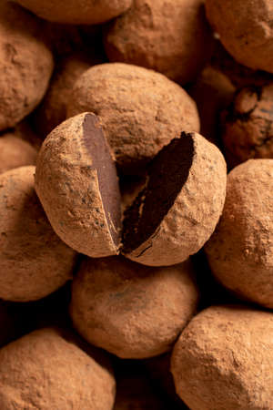Pile of sweet truffle candies in cocoa powder close-upの写真素材