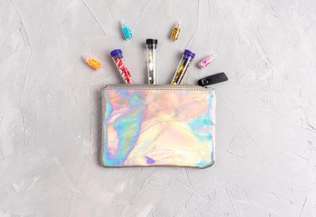 Marijuana concept. Sparkle flasks for transporting and storing medical marijuana in a cosmetic bag....