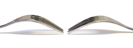 Two forks facing each other on a white background. Image could be used as a bannerの写真素材