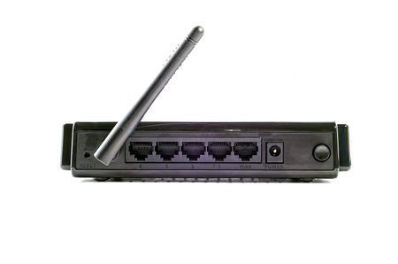 Black wi-fi router on the light background