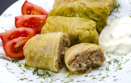 Stuffed cabbage leaves with meat and rice and sour cream の写真素材