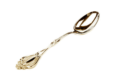 Isolated metallic tea spoon on white backgroundの写真素材