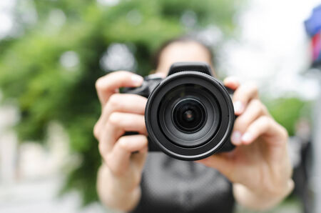Photographer takes pictures in the open airの写真素材