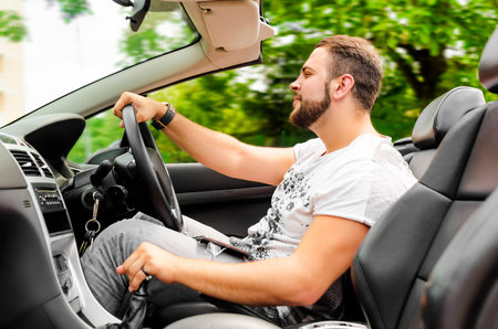 Portrait of a man driving his car