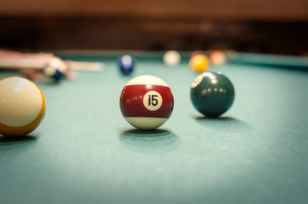 Playing billiard - Close-up shot of a man playing billiardの写真素材