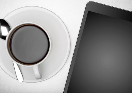 Workplace with tablet pc and cup of coffeeの写真素材