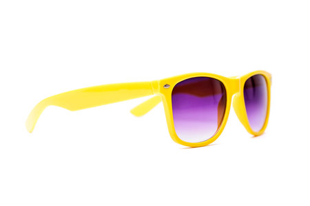 Yellow sun glasses isolated over the white background
