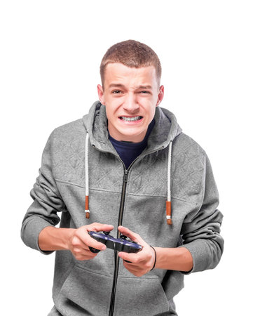 Young man with a joystick for game console. Isolated on white.