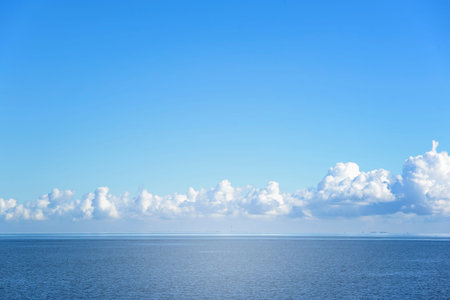 Blue sea and clouds on the horizon.