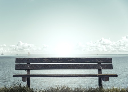 Empty bench on the seafront. Toned photo.の写真素材