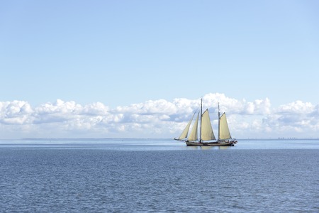 Sailing ship in the open blue sea.の写真素材