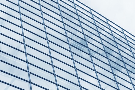 The wall of glass windows of a modern building.の写真素材