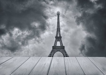 Eiffel tower in Paris and wooden platform and cloudy dark dramatic sky. Toned photo.の写真素材