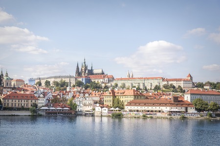Old town and Prague castle with river Vltava, Czech Republic. Toned photo.の写真素材