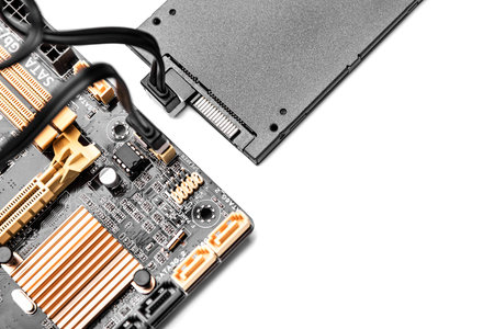 SSD hard drive with cable connected to motherboard.  Concept of cloud drive, or communications.