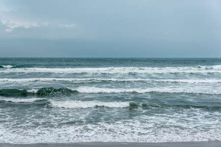 Dark stormy sky and stormy sea waves.の写真素材