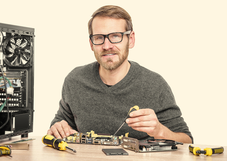 Man breaks his head on the problem of the computer. Toned image.の写真素材