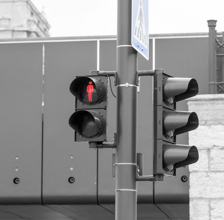 Traffic light on a pedestrian crossing in the city.
