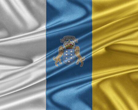 Canary Islands flag. Flag with a beautiful glossy silk texture.の写真素材