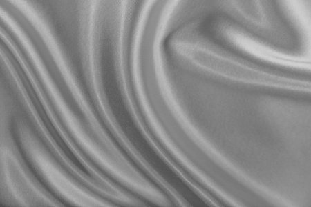 Silver silk texture of satin abstract background.の写真素材