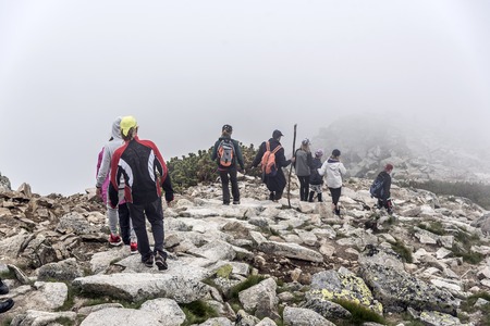 Group of hikers descending on a mountain.のeditorial素材