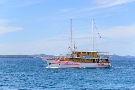 Boat in the sea against the backdrop of a blue sky.